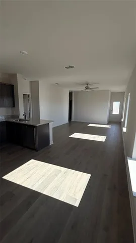 a view of a kitchen with furniture and a window
