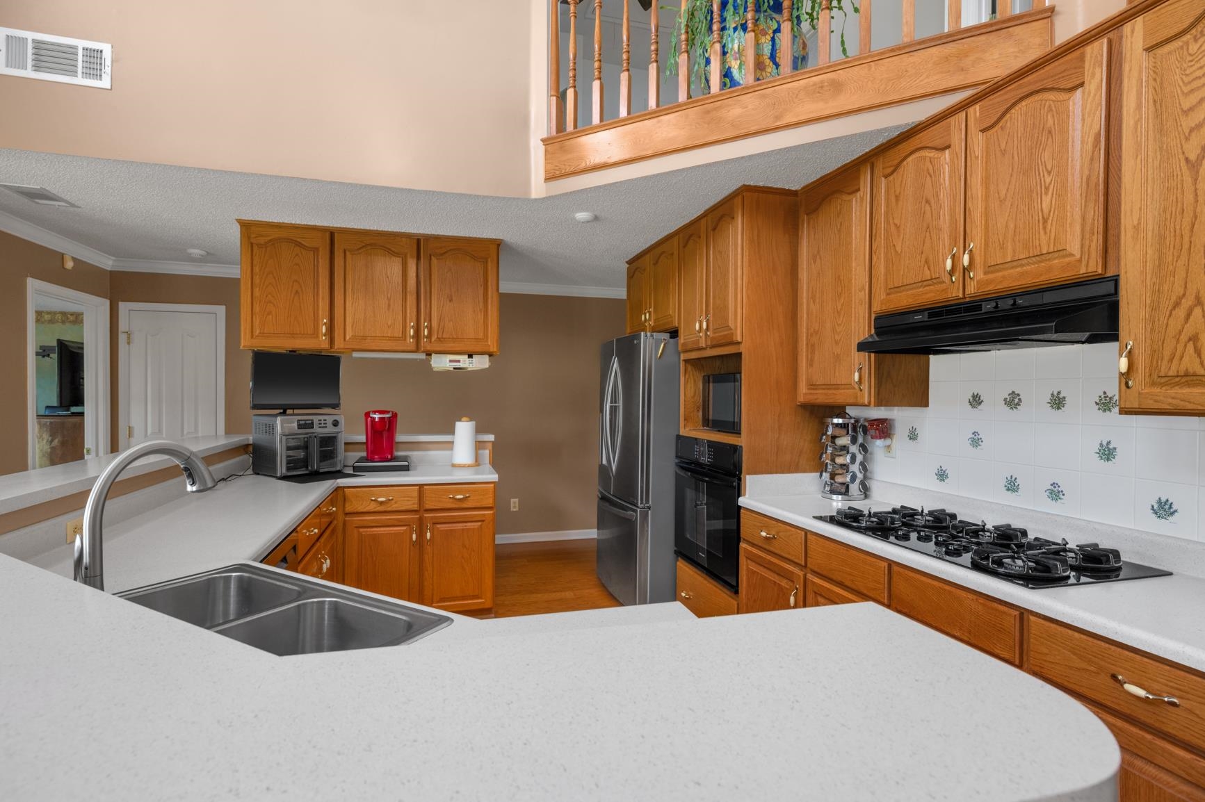 8539 Campground Road Drummonds, TN 38023 - Photo 15 of 38 a kitchen with stainless steel appliances granite countertop a sink stove and refrigerator