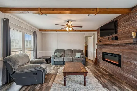 a kitchen with stainless steel appliances granite countertop a sink a stove and cabinets