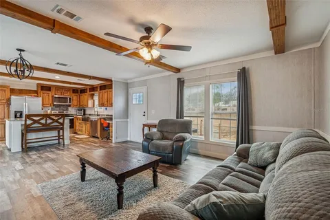 a kitchen with granite countertop a sink and a stove