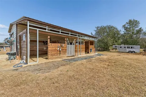 a terrace of a house with outdoor seating