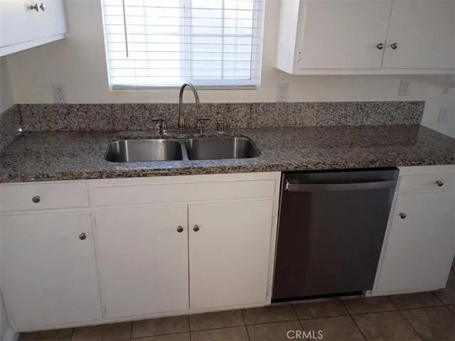 a bathroom with a toilet and a mirror