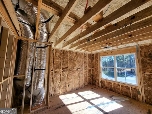 a view of an empty room with windows