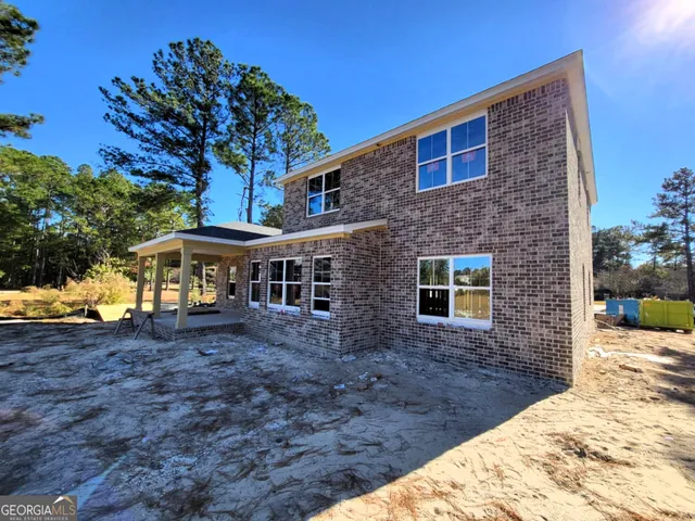 a backyard of a house with lots of green space