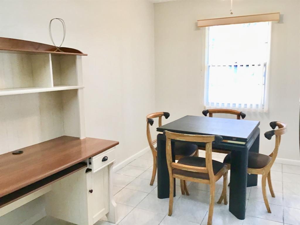 1004 Newcastle A, Unit 1004 Boca Raton, FL 33434 - Photo 14 of 39 a view of a workspace with furniture