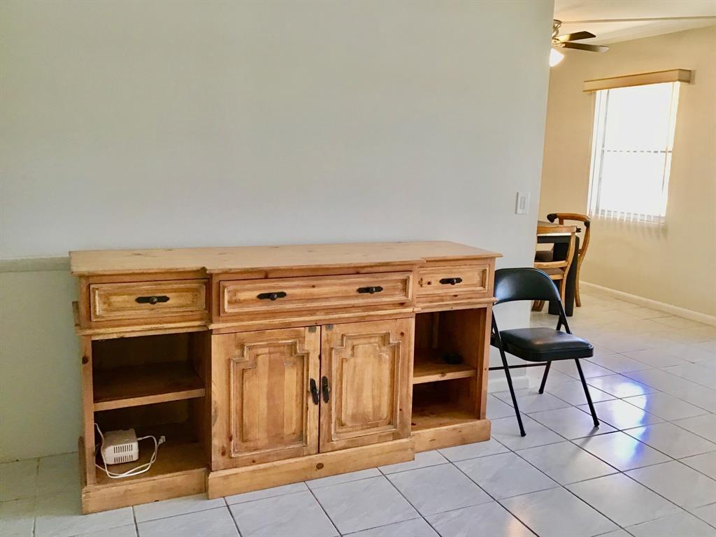 1004 Newcastle A, Unit 1004 Boca Raton, FL 33434 - Photo 15 of 39 a view of a livingroom with furniture and a fireplace