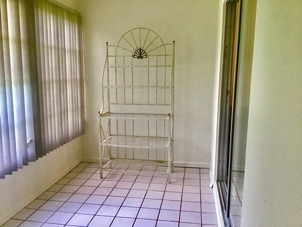 1004 Newcastle A, Unit 1004 Boca Raton, FL 33434 - Photo 27 of 39 an empty room with windows