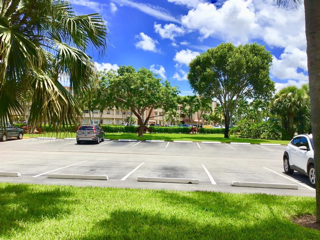 1004 Newcastle A, Unit 1004 Boca Raton, FL 33434 - Photo 28 of 39 a view of a park with plants and trees