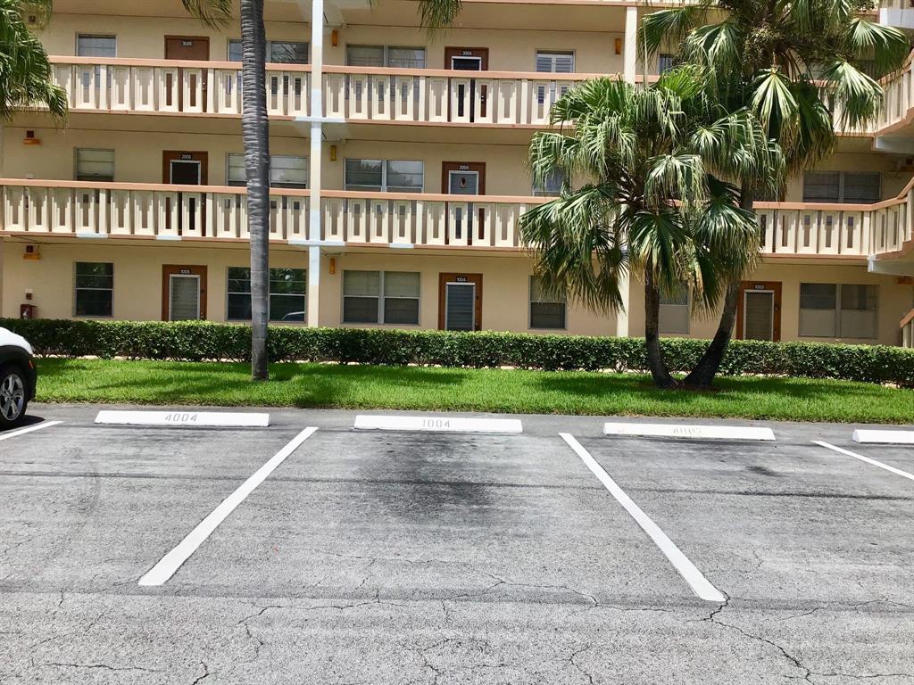 1004 Newcastle A, Unit 1004 Boca Raton, FL 33434 - Photo 3 of 39 a front view of a house