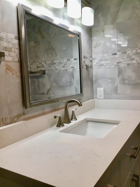 1004 Newcastle A, Unit 1004 Boca Raton, FL 33434 - Photo 7 of 39 a bathroom with a sink and mirror