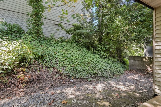 a view of a city street with parked cars