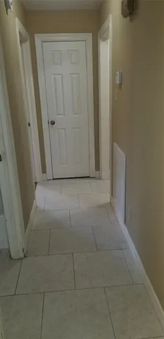 a view of hallway with shower