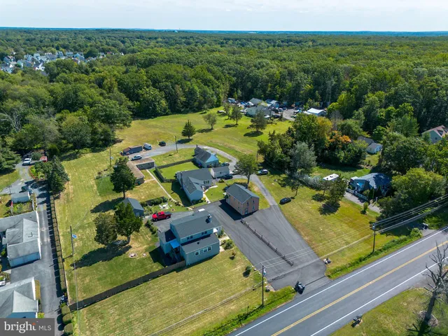 an aerial view of a house with a garden