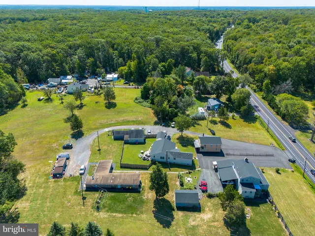 a view of a swimming pool with a yard