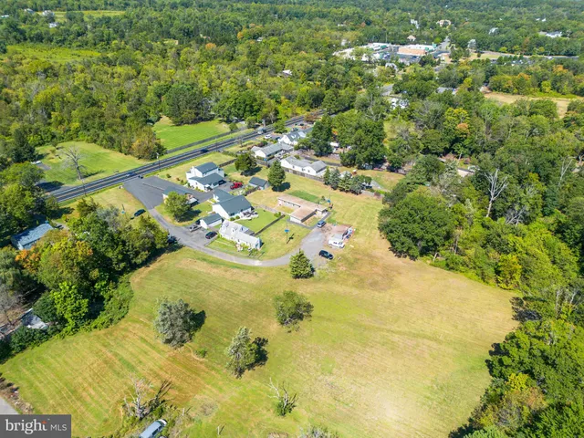 a view of a swimming pool and trees