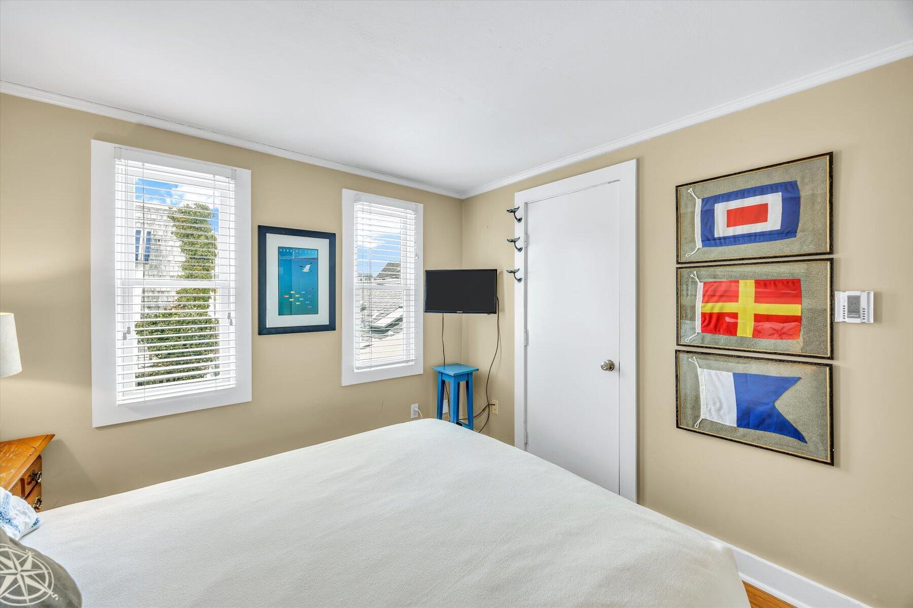 15 Cottage Street, Unit 2 Provincetown, MA 02657 - Photo 12 of 27 a bedroom with a bed and a window