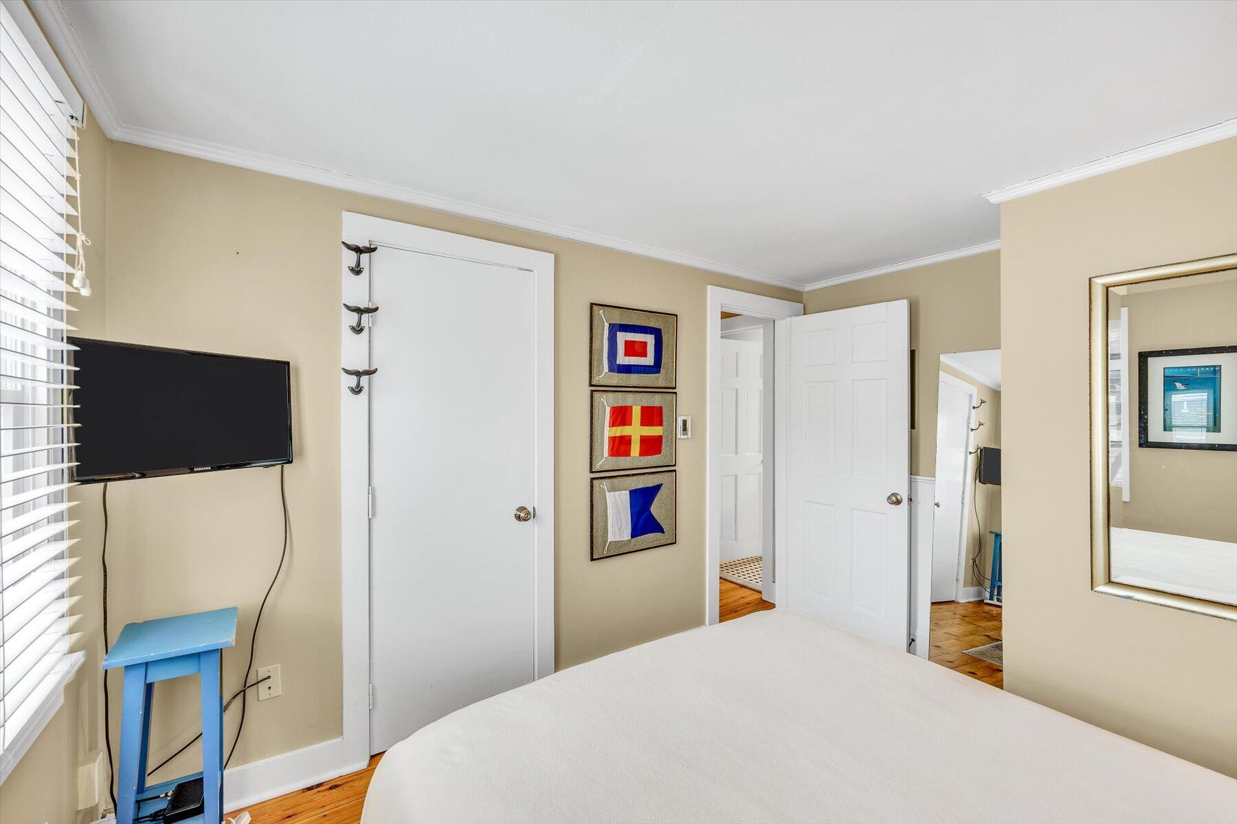15 Cottage Street, Unit 2 Provincetown, MA 02657 - Photo 13 of 27 a bedroom with a bed and a flat screen tv