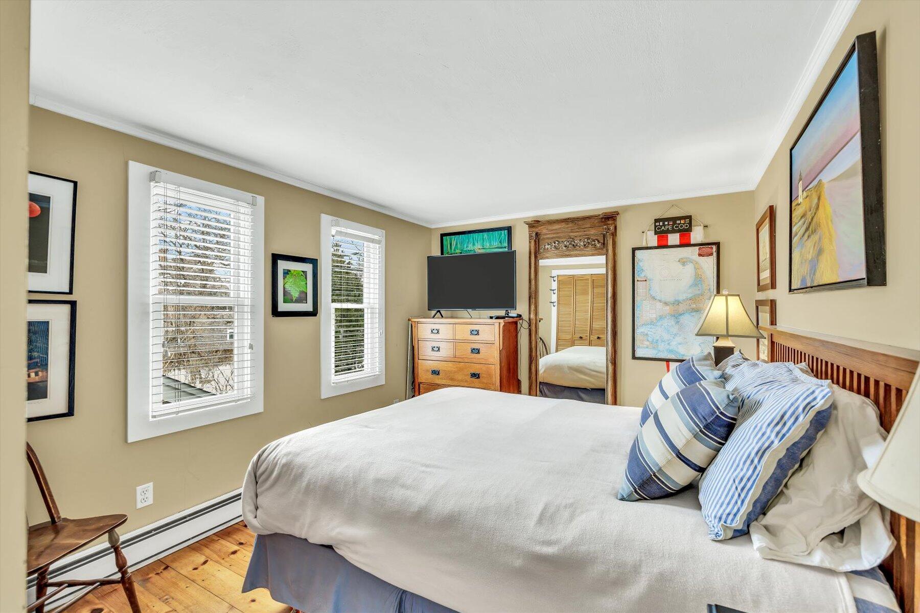 15 Cottage Street, Unit 2 Provincetown, MA 02657 - Photo 17 of 27 a bedroom with a large bed and a window