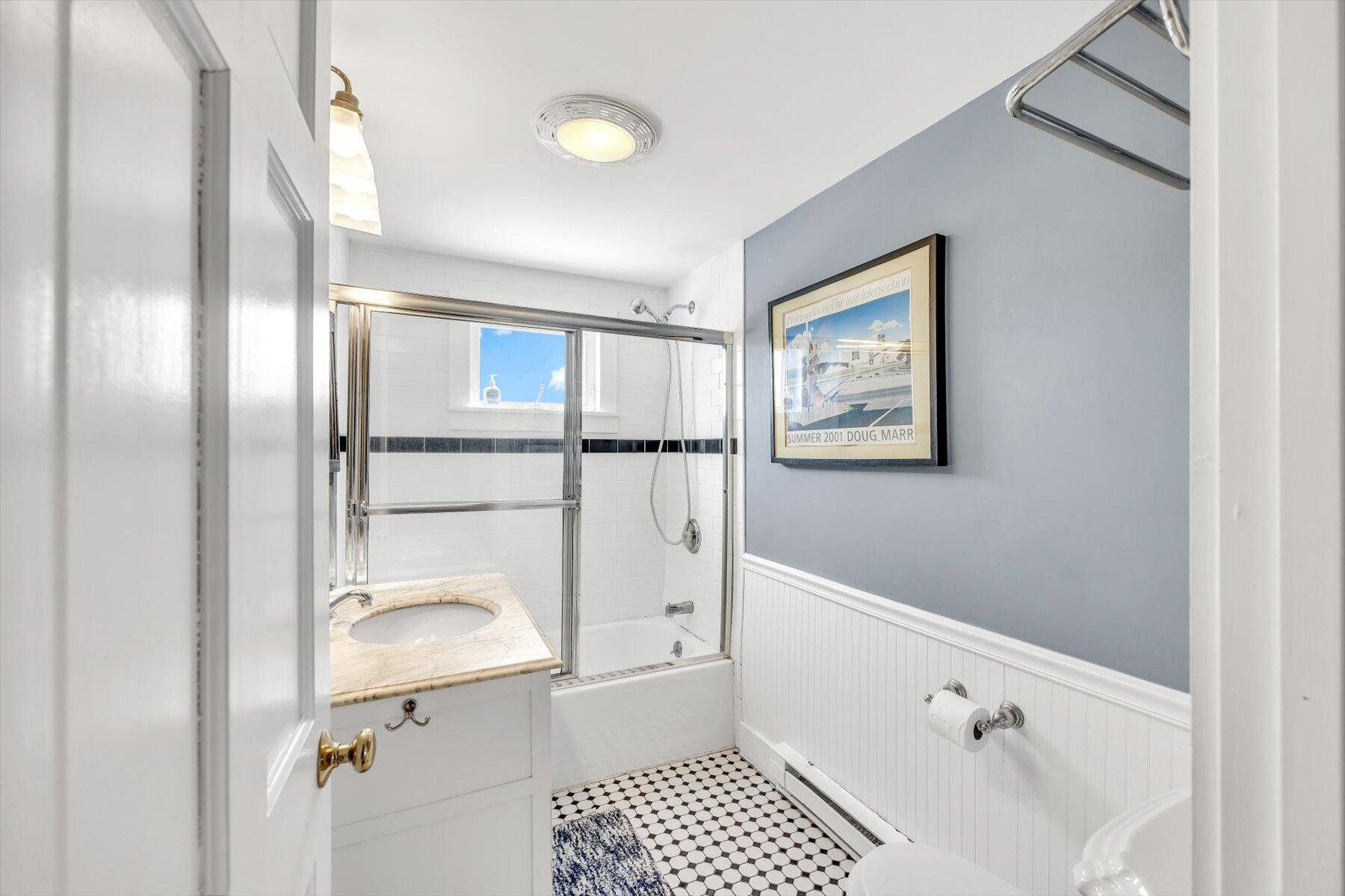 15 Cottage Street, Unit 2 Provincetown, MA 02657 - Photo 23 of 27 a bathroom with a bathtub and a shower