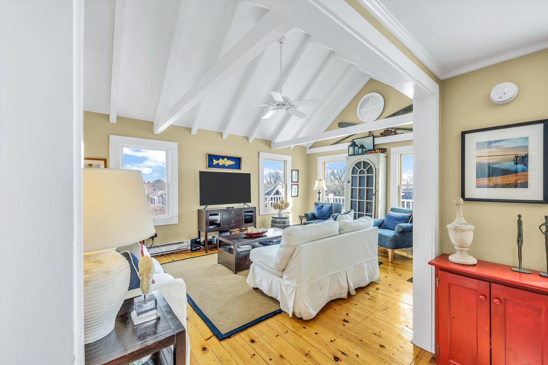 15 Cottage Street, Unit 2 Provincetown, MA 02657 - Photo 5 of 27 a living room with furniture and a flat screen tv