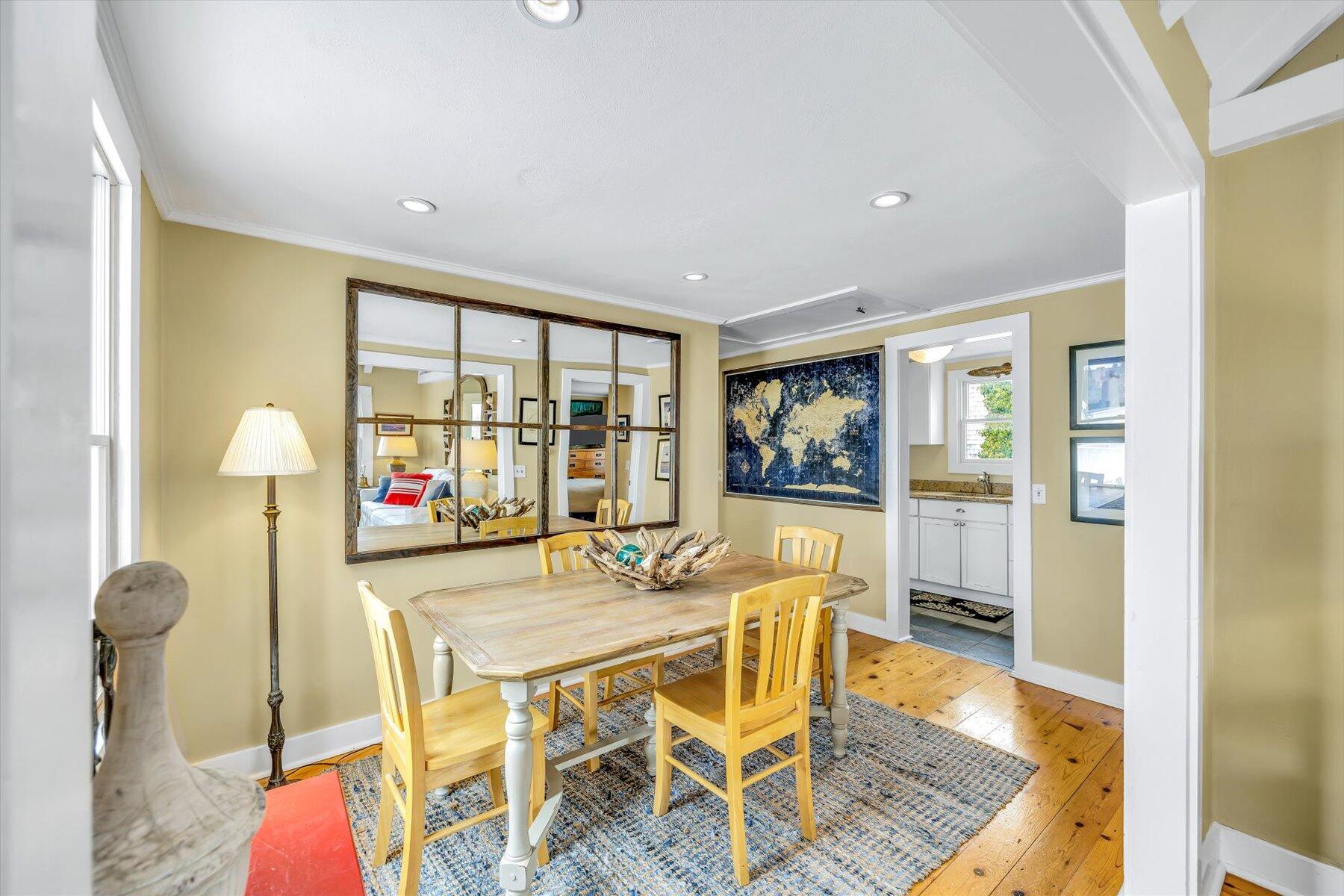 15 Cottage Street, Unit 2 Provincetown, MA 02657 - Photo 7 of 27 a dining room with furniture and a floor to ceiling window