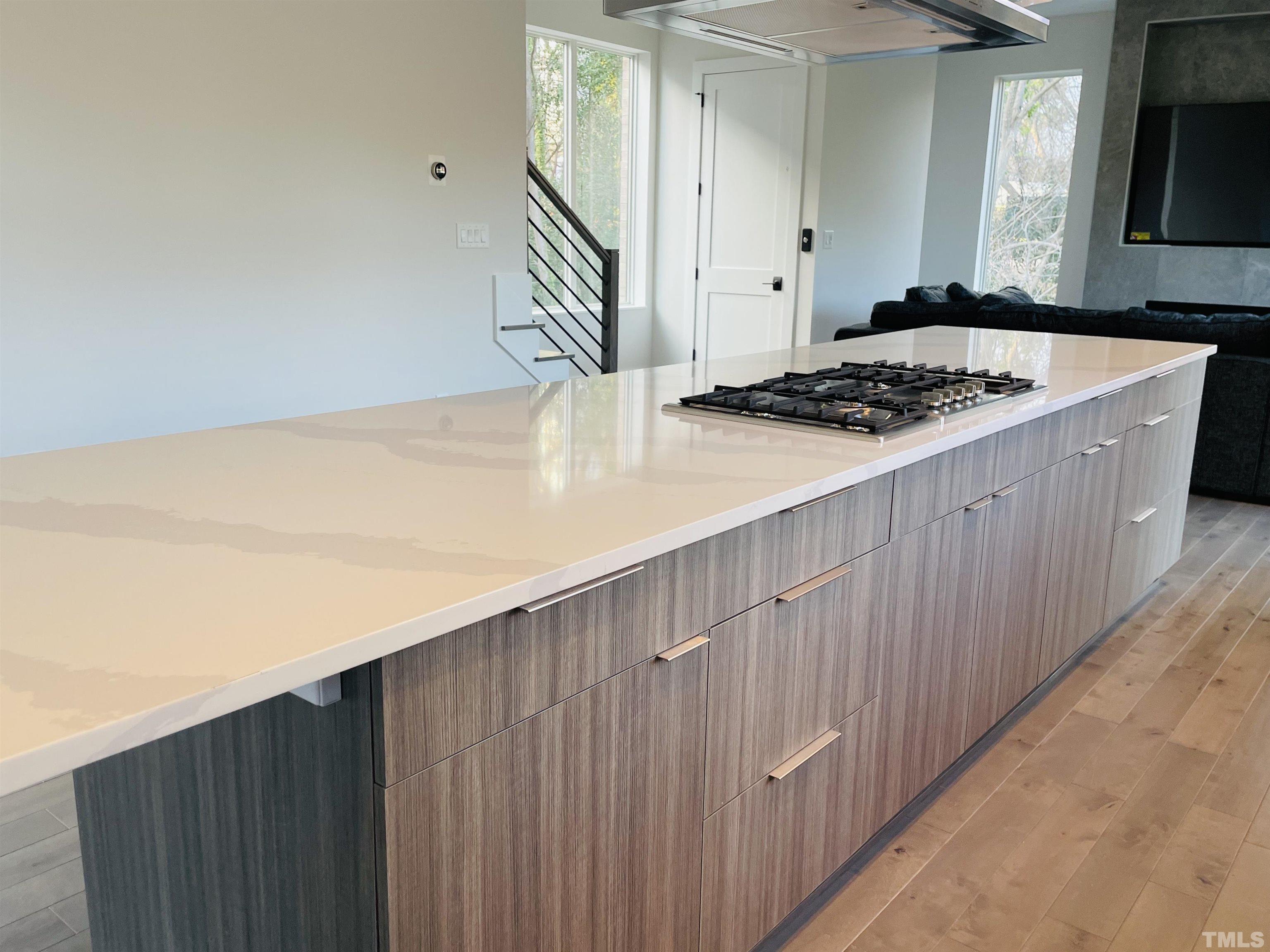 1026 Manor Way Durham, NC 27701 - Photo 11 of 24 a kitchen with a wooden cabinets and a stove top oven