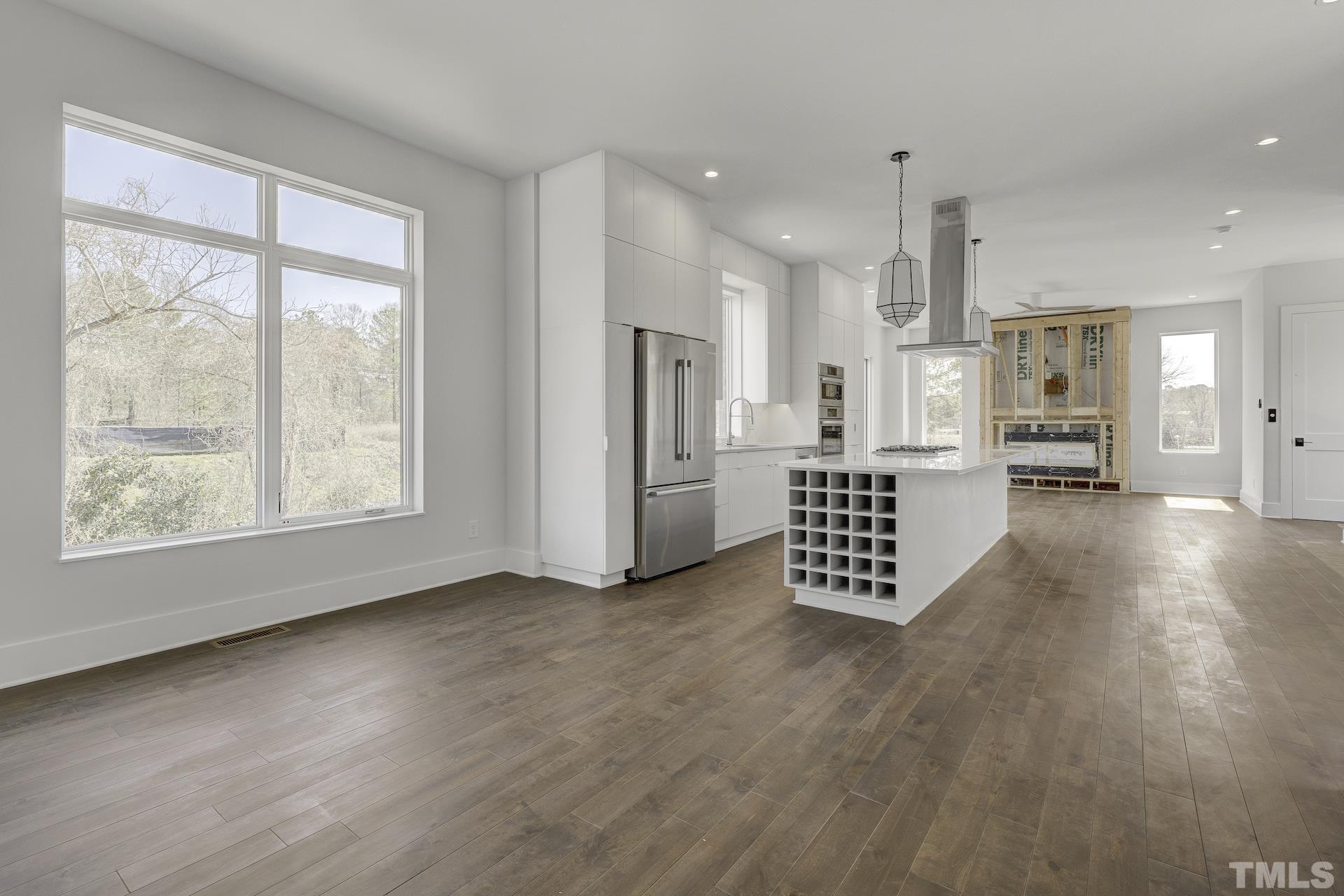 1026 Manor Way Durham, NC 27701 - Photo 8 of 24 a view of an empty room with a window and wooden floor