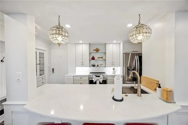 a view of kitchen with chandelier
