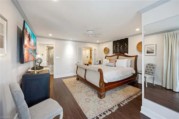 a bedroom with a bed window and a couch