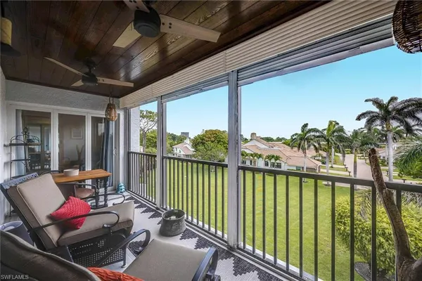 a view of a balcony with chairs