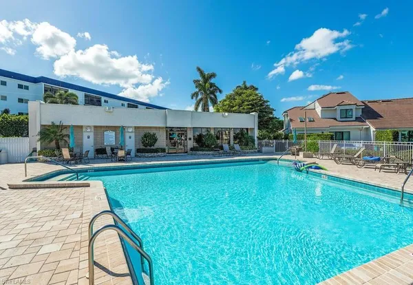 a view of swimming pool is middle and a garden