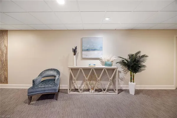 a room with table and flowerpot