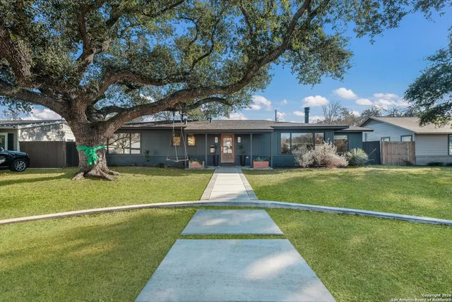 a view of swimming pool next to a yard