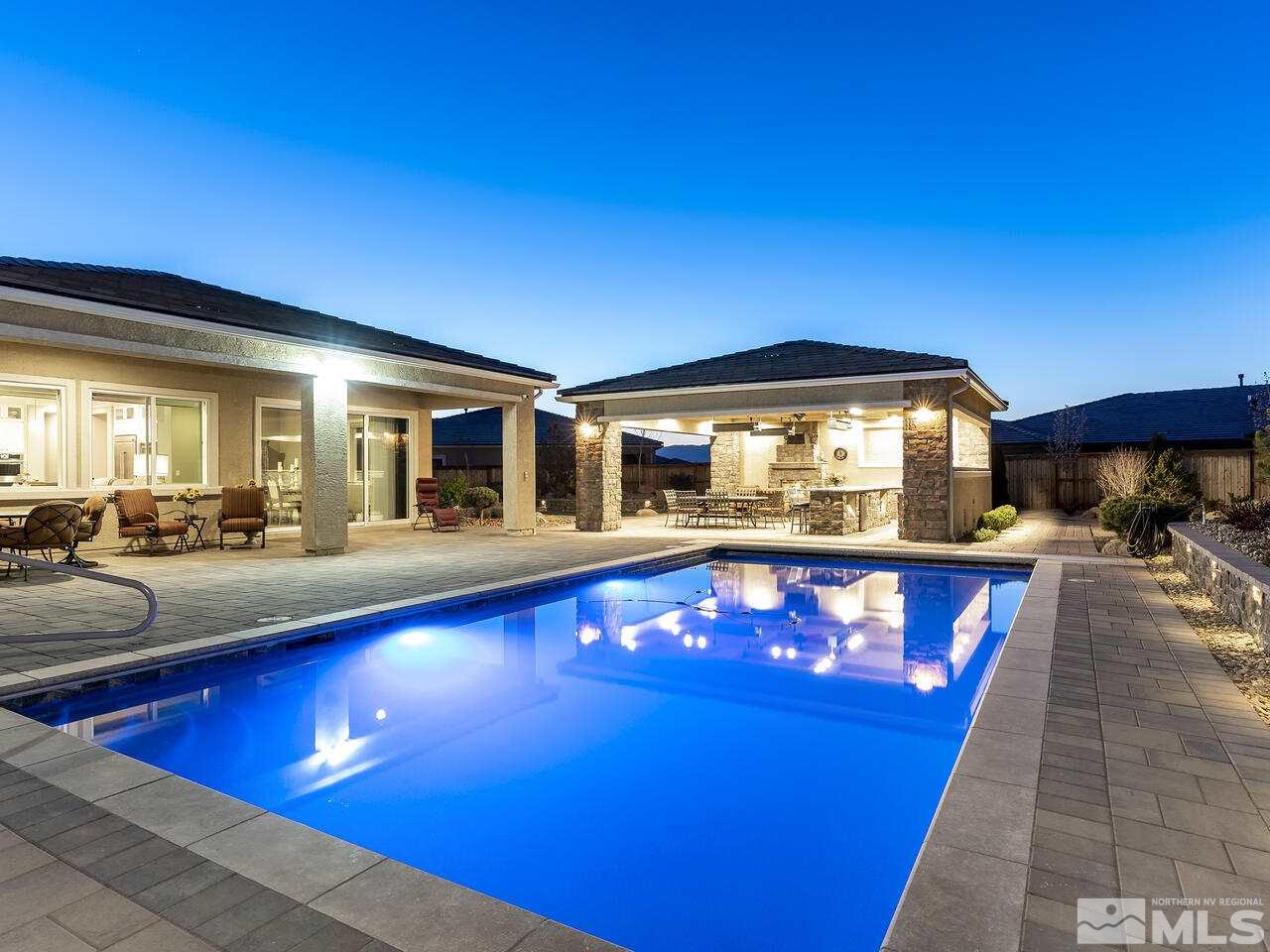 2913 Miramis Court Reno, NV 89521 - Photo 1 of 40 a view of swimming pool with outdoor seating