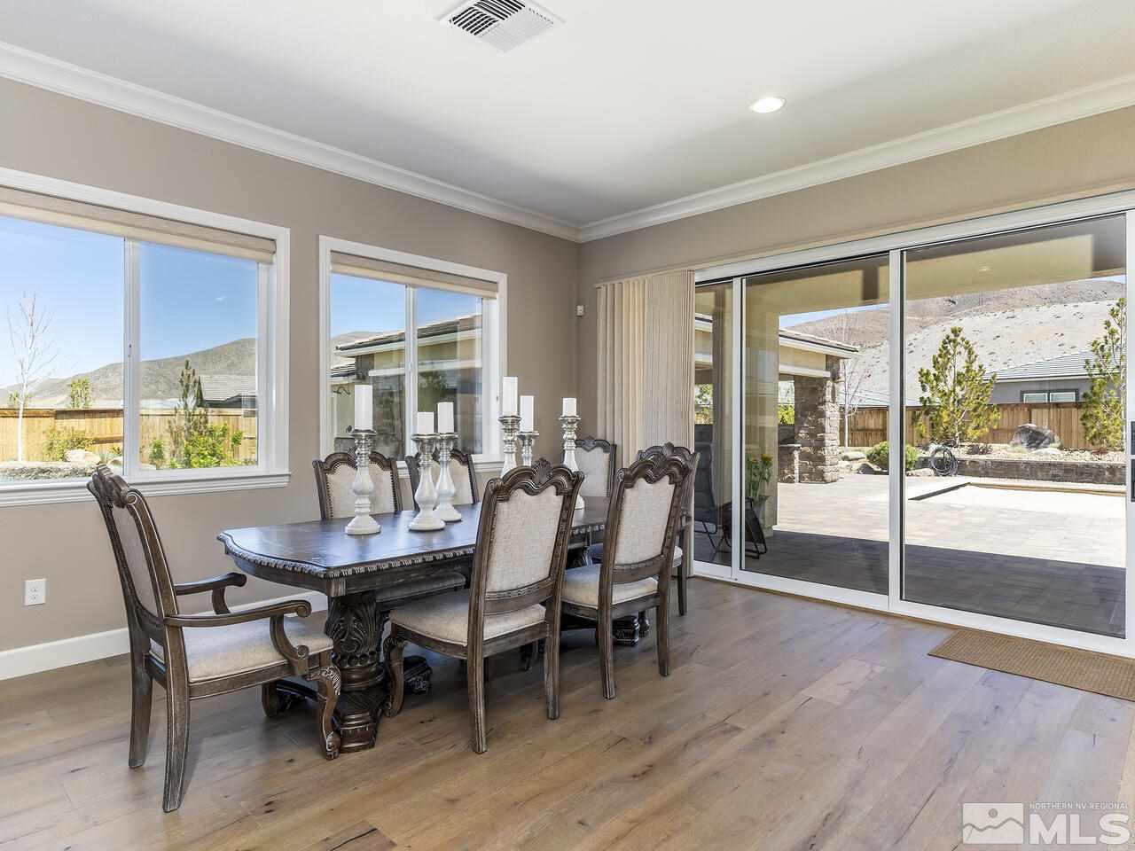 2913 Miramis Court Reno, NV 89521 - Photo 12 of 40 a view of a dining room with furniture window and outside view