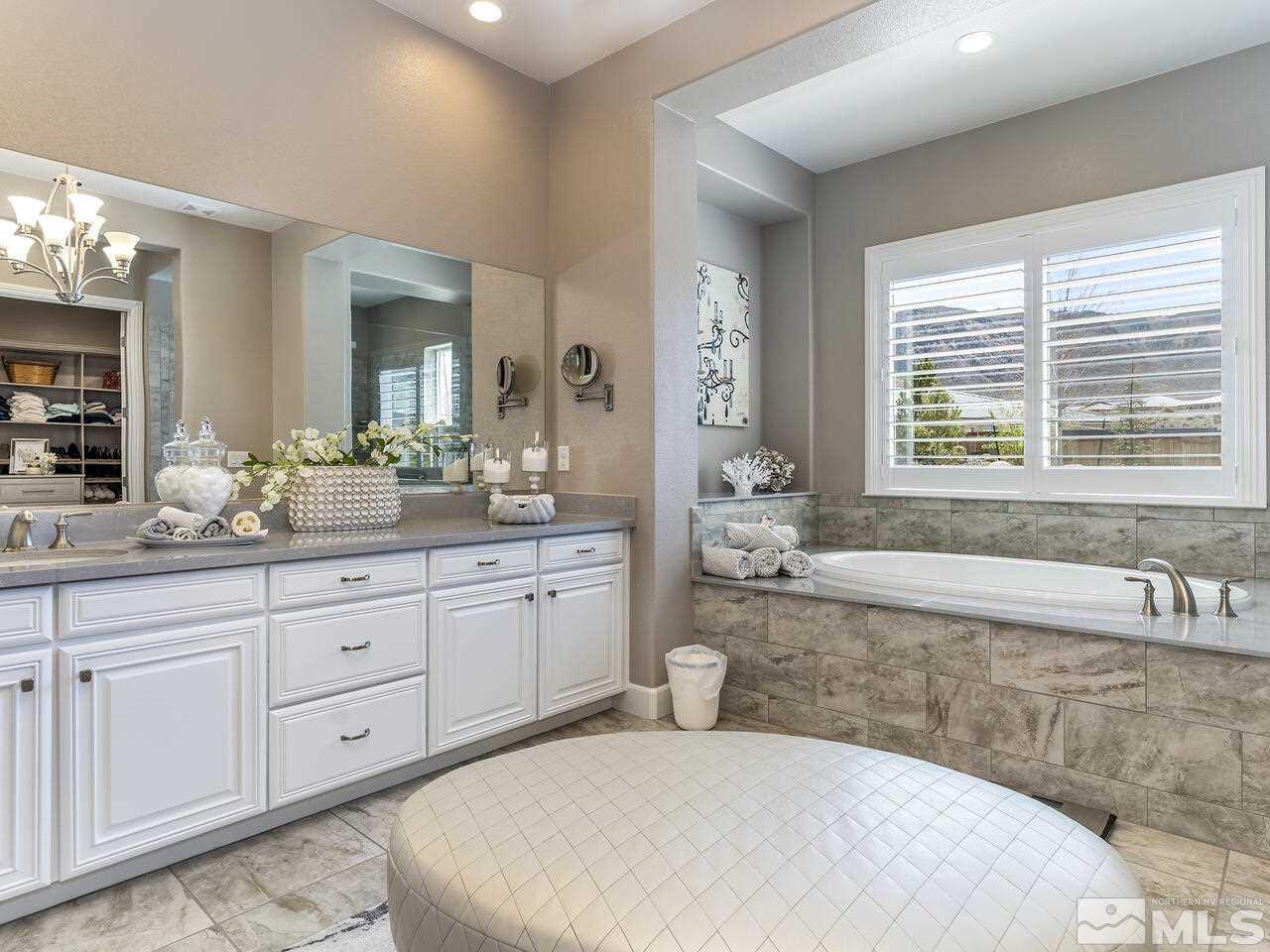 2913 Miramis Court Reno, NV 89521 - Photo 20 of 40 a spacious bathroom with a tub sink and mirror