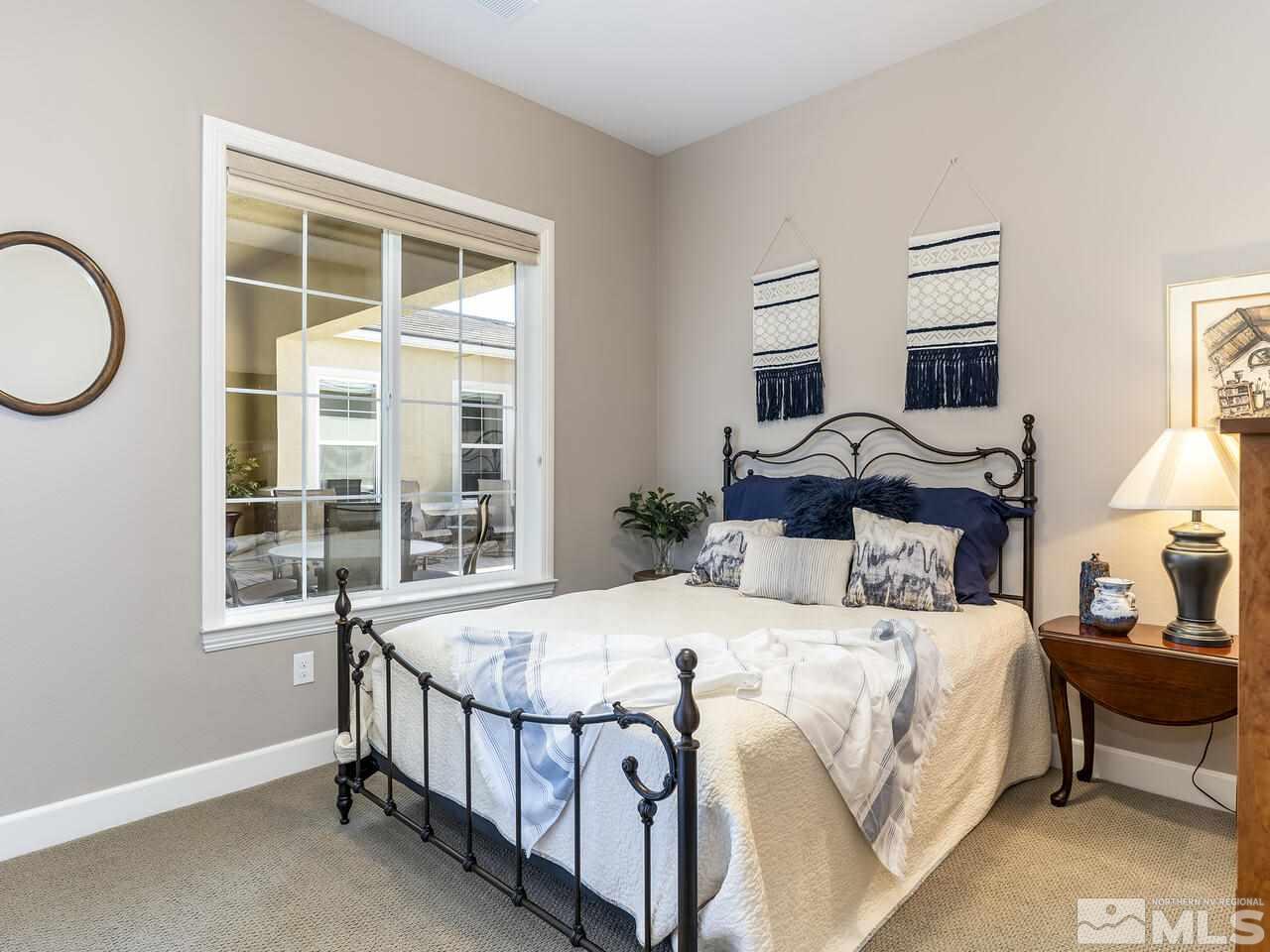 2913 Miramis Court Reno, NV 89521 - Photo 27 of 40 a bedroom with a bed and a window