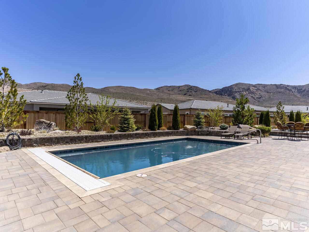 2913 Miramis Court Reno, NV 89521 - Photo 33 of 40 a view of swimming pool and trees in the background