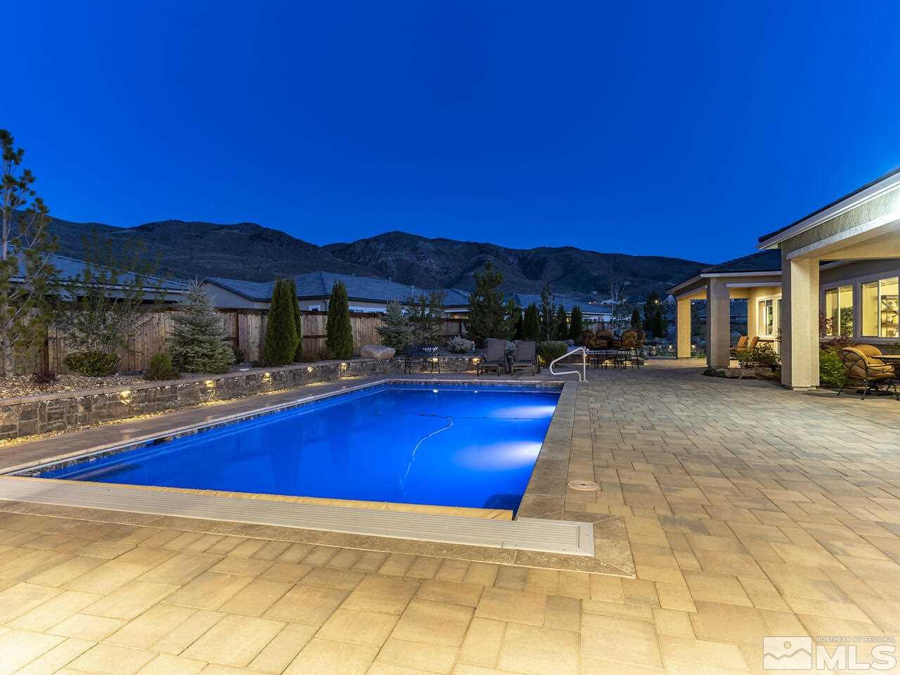 2913 Miramis Court Reno, NV 89521 - Photo 34 of 40 a view of swimming pool with outdoor seating and yard