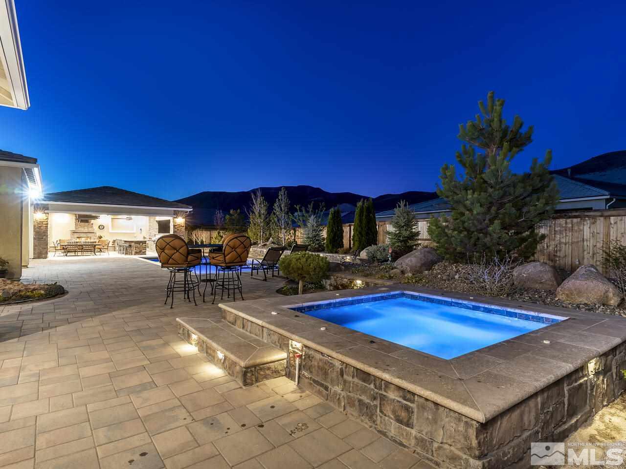 2913 Miramis Court Reno, NV 89521 - Photo 39 of 40 a view of a chairs and table in patio with a barbeque