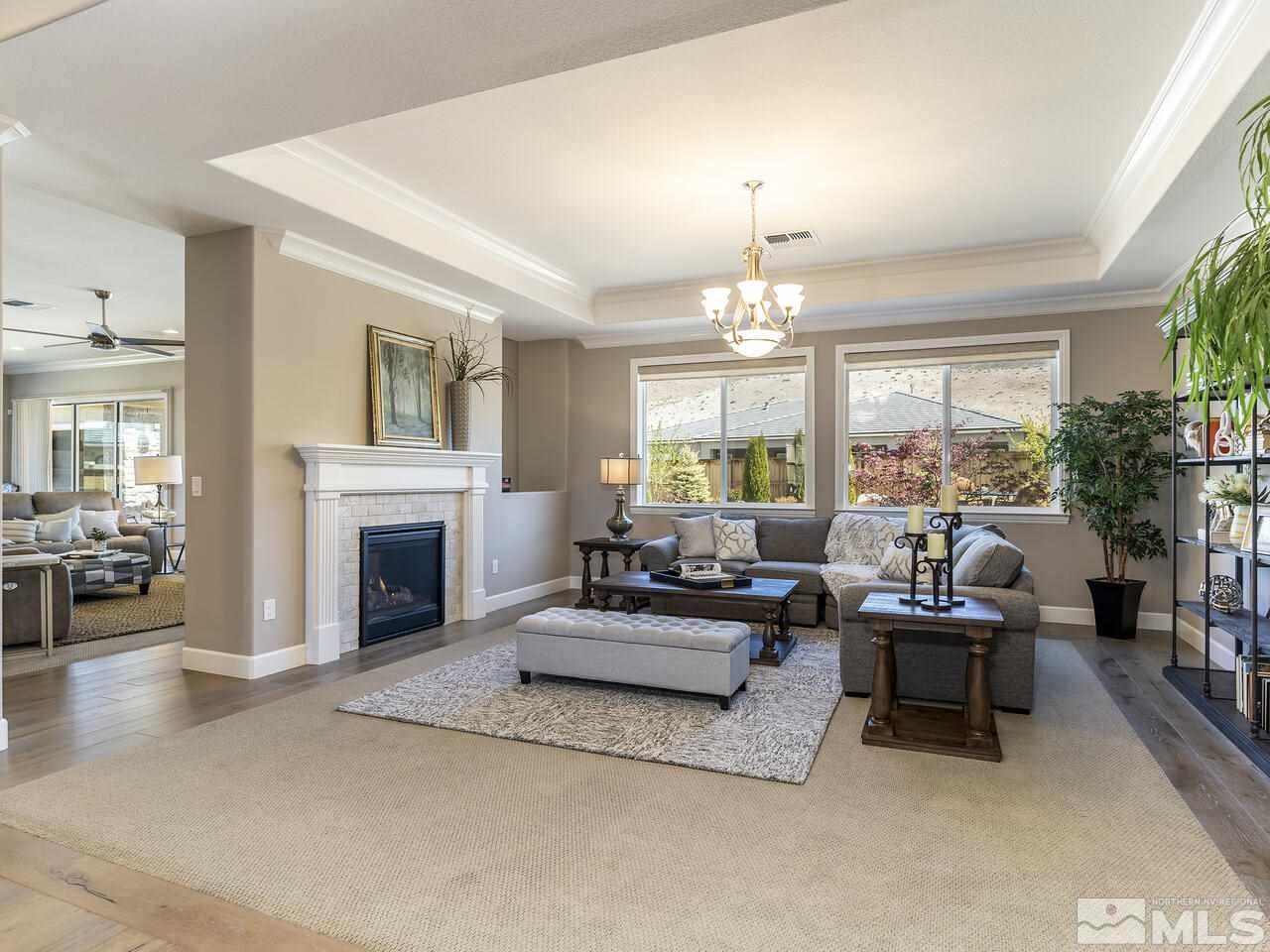 2913 Miramis Court Reno, NV 89521 - Photo 7 of 40 a living room with furniture and a fireplace