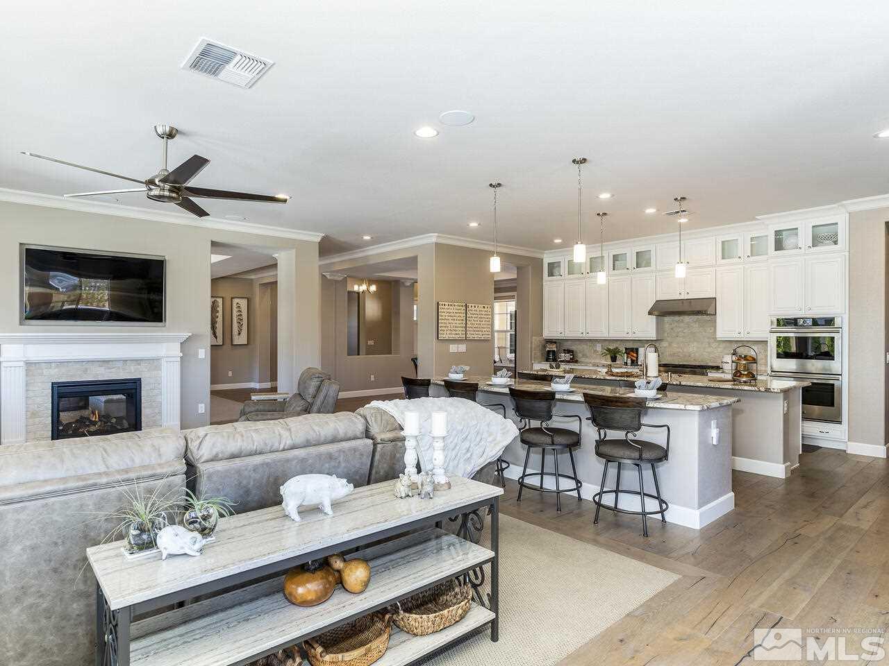 2913 Miramis Court Reno, NV 89521 - Photo 10 of 40 a living room with furniture kitchen view and a fireplace