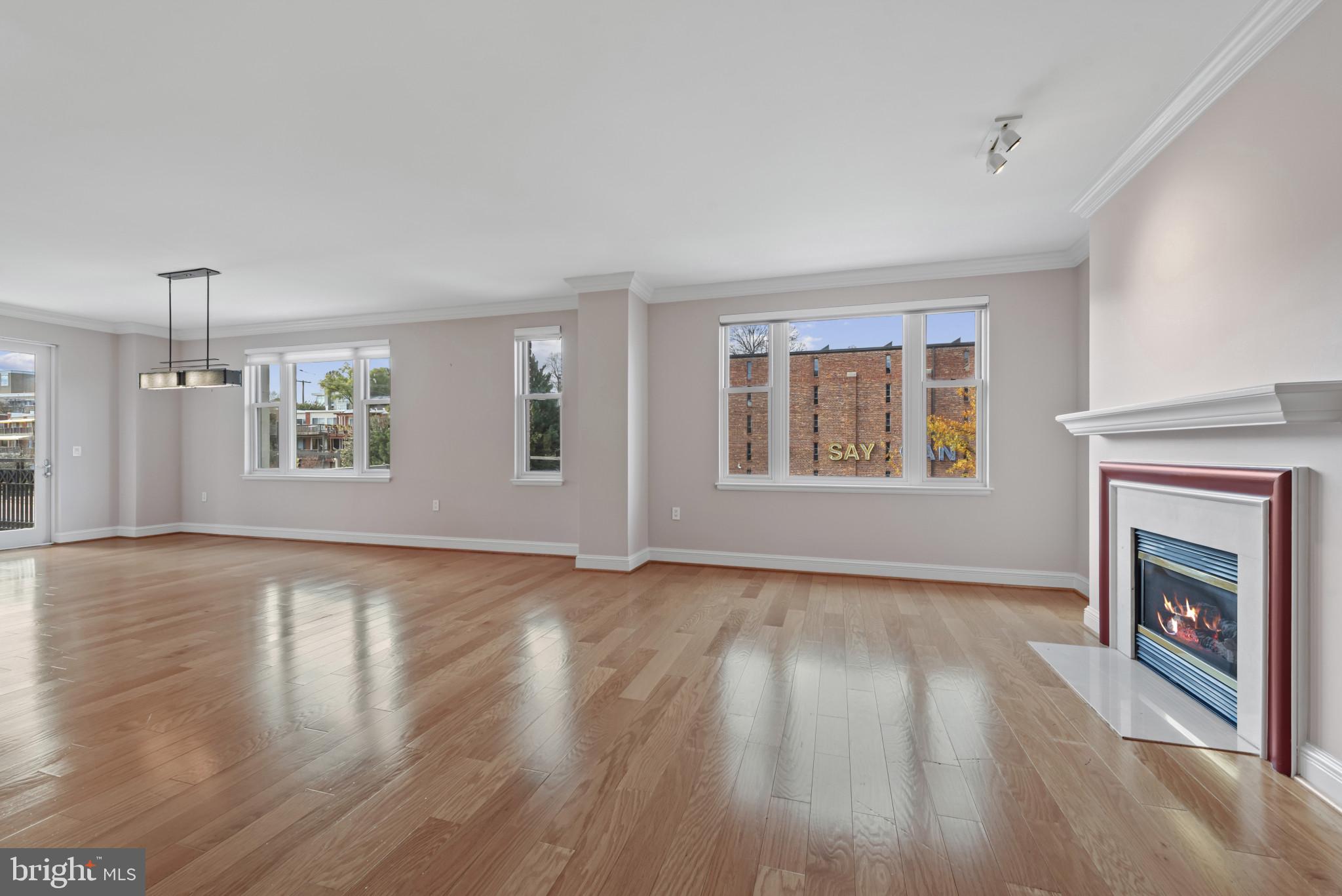 801 Key Highway, Unit 364 Baltimore, MD 21230 - Photo 11 of 54 a view of an empty room with window and fire place