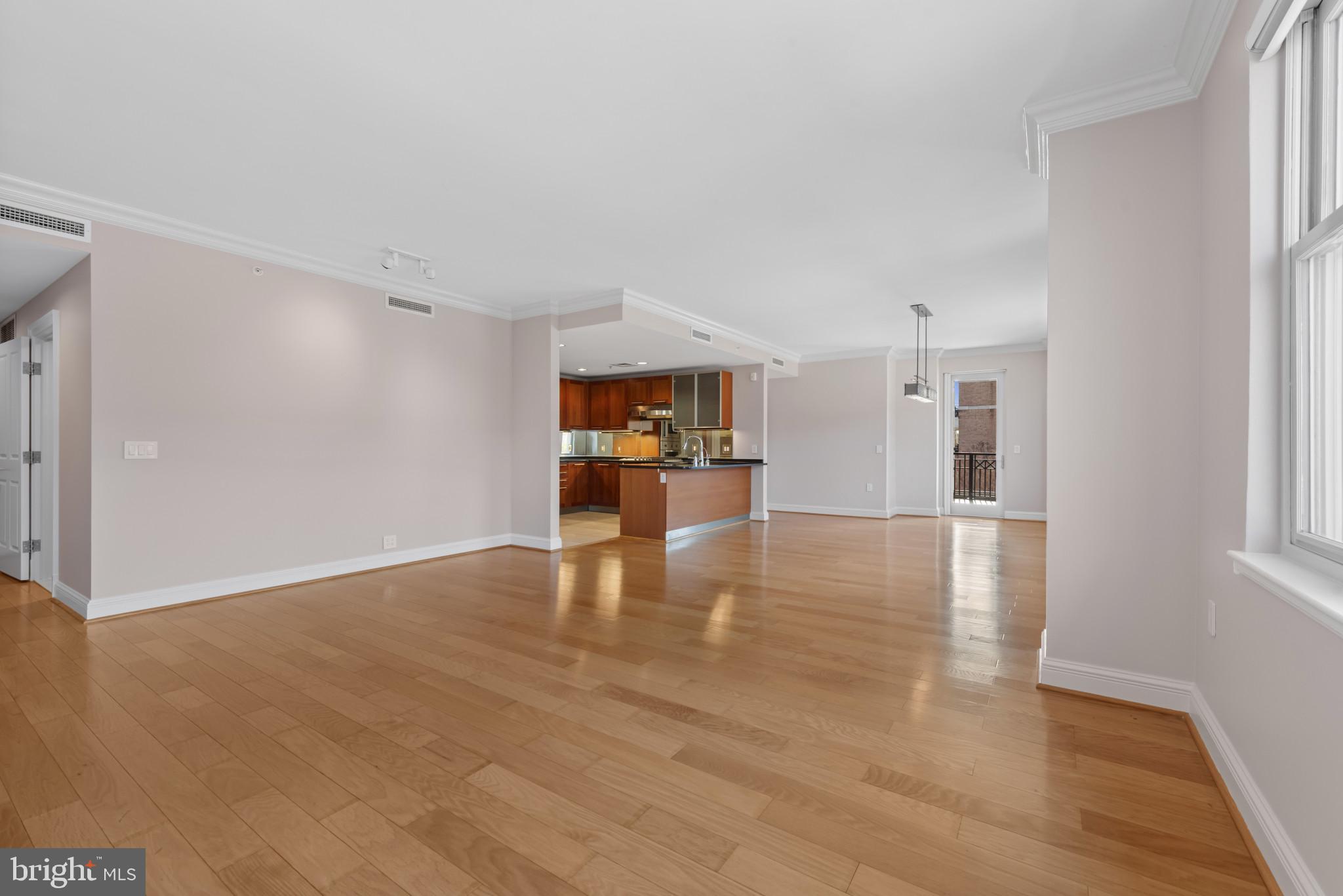 801 Key Highway, Unit 364 Baltimore, MD 21230 - Photo 15 of 54 a view of a living room and a kitchen with a sink