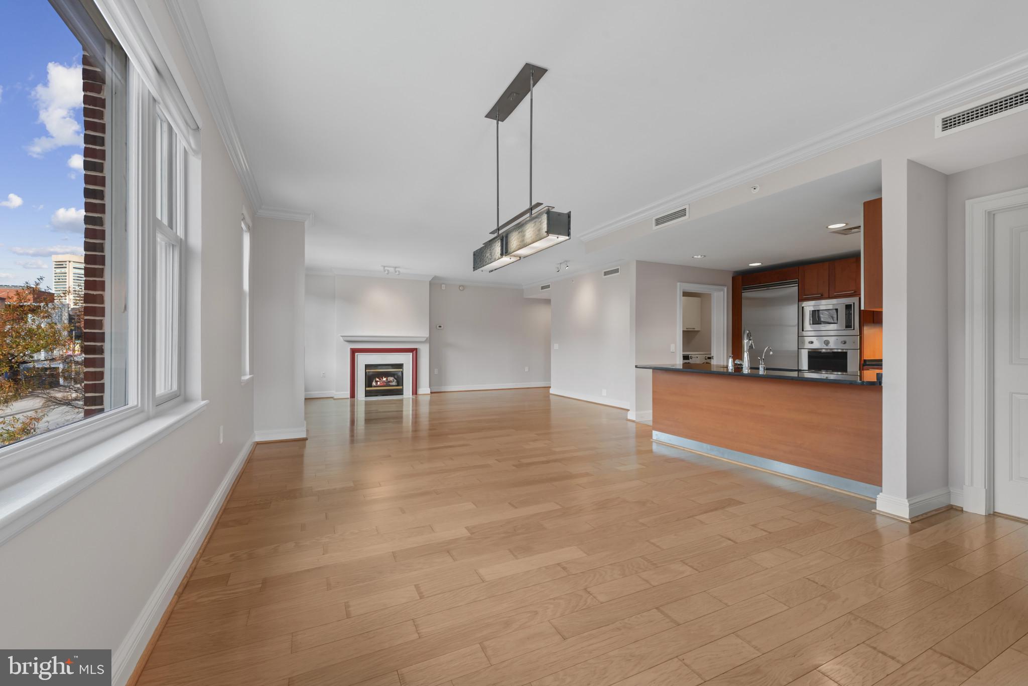 801 Key Highway, Unit 364 Baltimore, MD 21230 - Photo 20 of 54 a view of a livingroom with a furniture wooden floor and a window