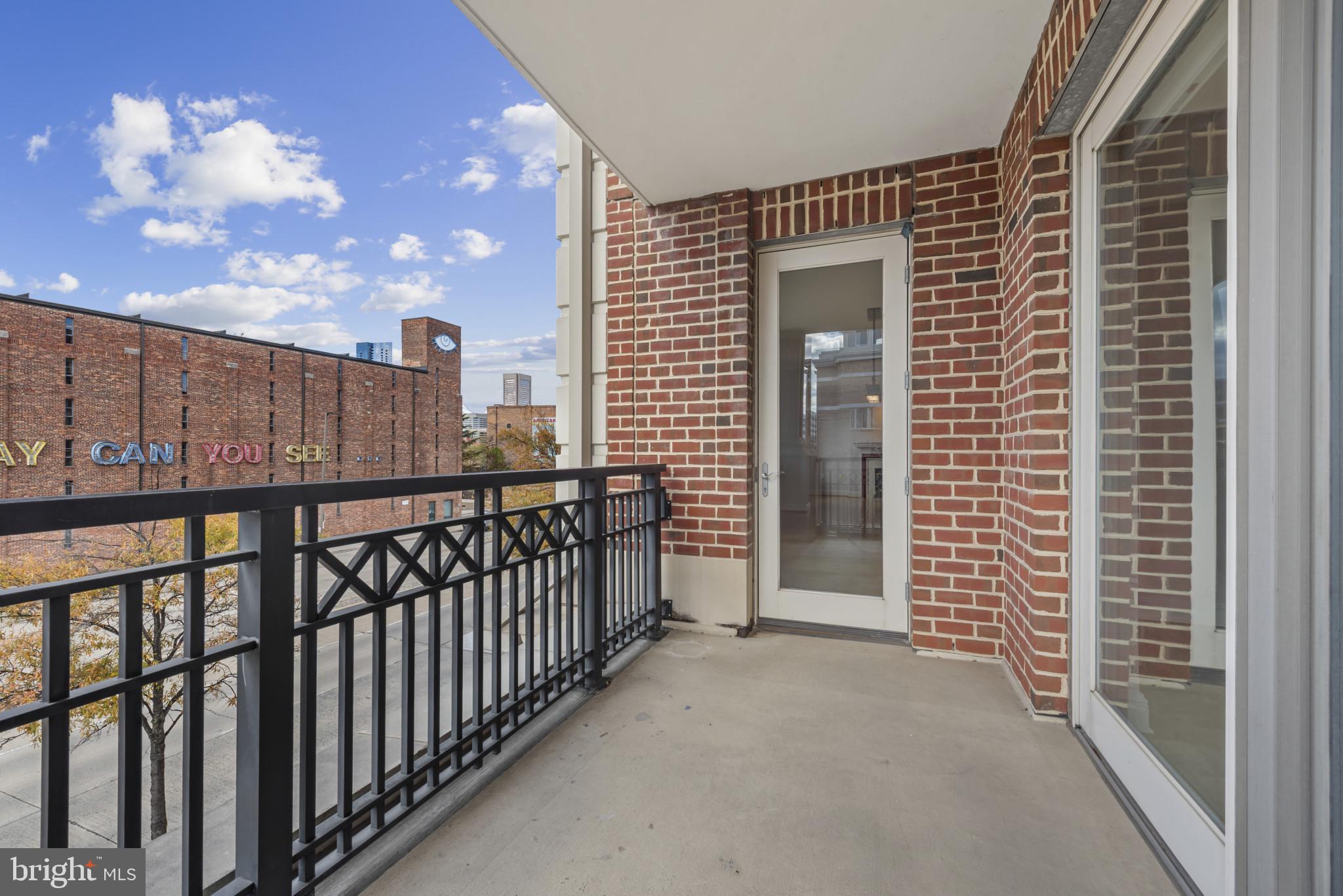 801 Key Highway, Unit 364 Baltimore, MD 21230 - Photo 24 of 54 Balcony from Living Area and Bedroom