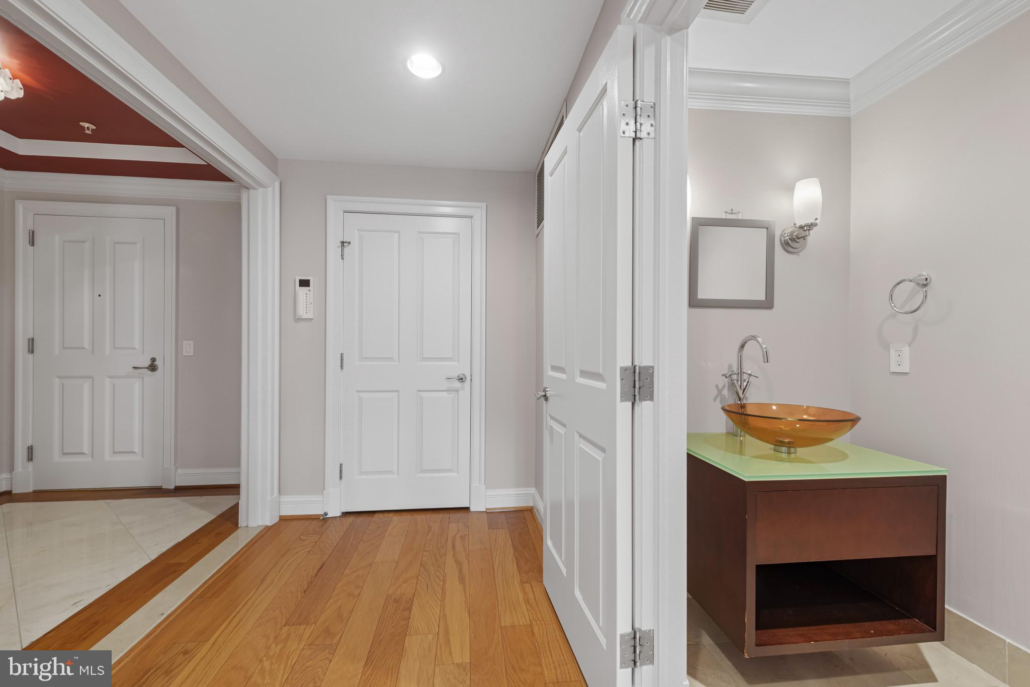 801 Key Highway, Unit 364 Baltimore, MD 21230 - Photo 25 of 54 a bathroom with a sink and a mirror