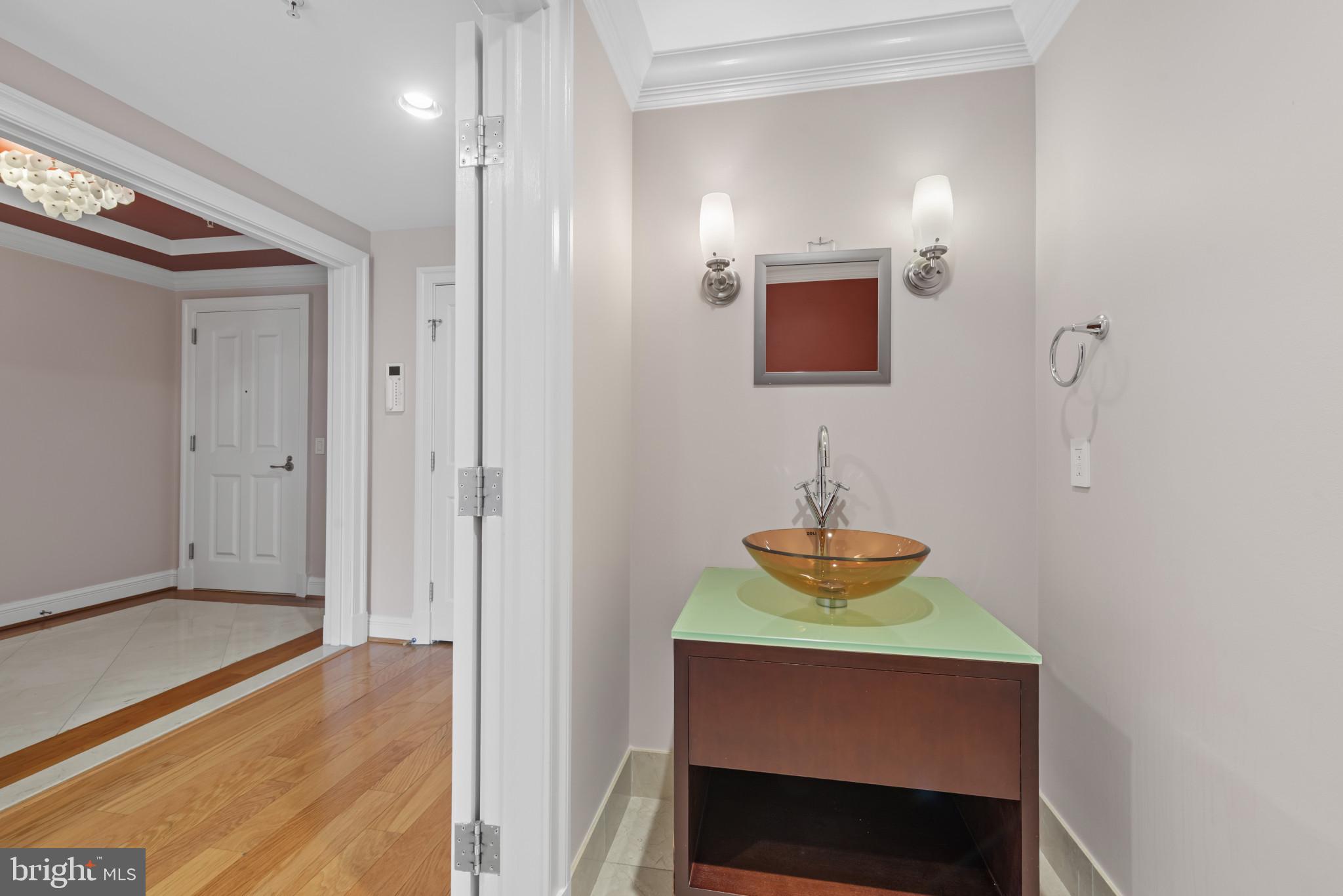 801 Key Highway, Unit 364 Baltimore, MD 21230 - Photo 26 of 54 a bathroom with a sink and a mirror