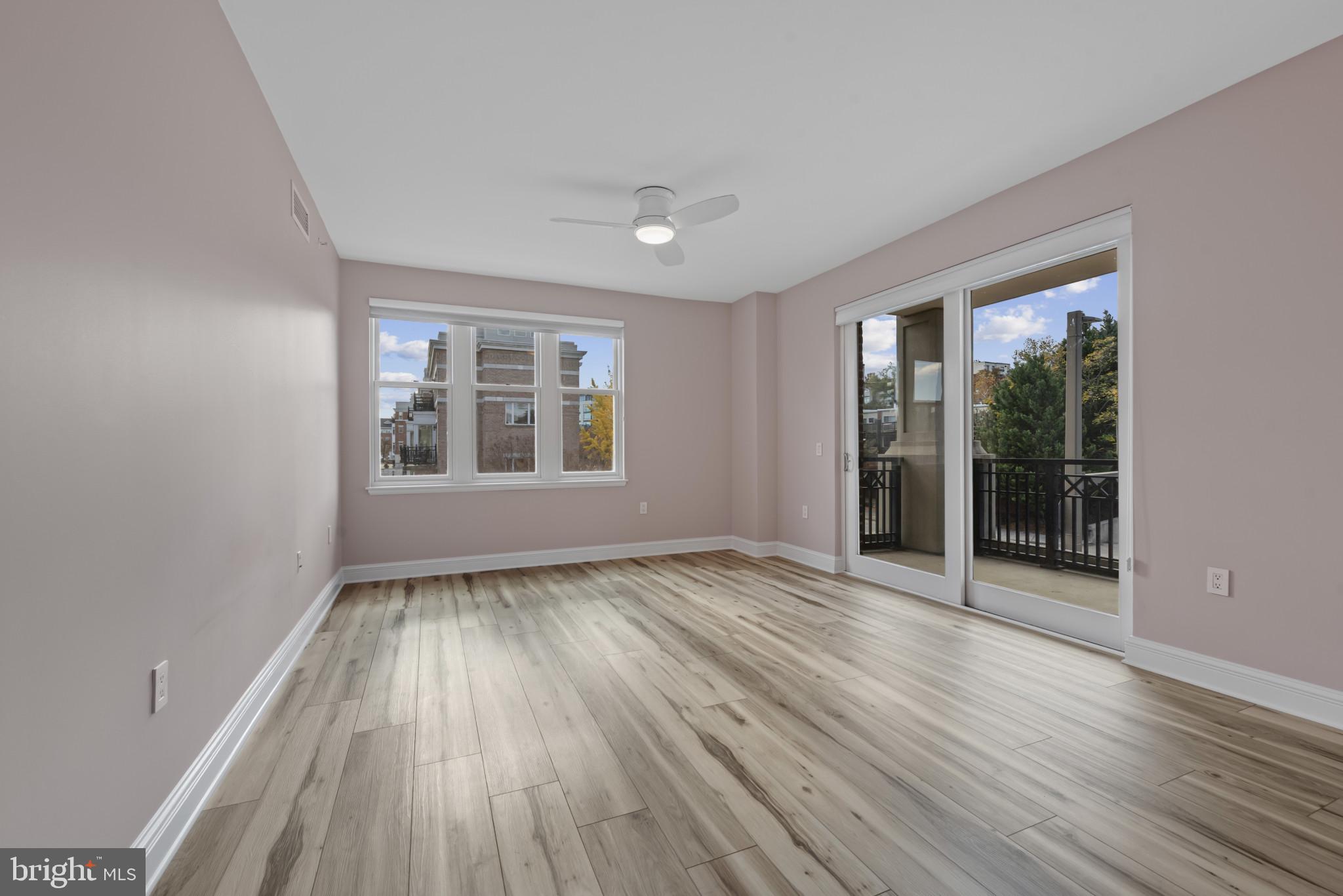 801 Key Highway, Unit 364 Baltimore, MD 21230 - Photo 28 of 54 wooden floor in an empty room with a window