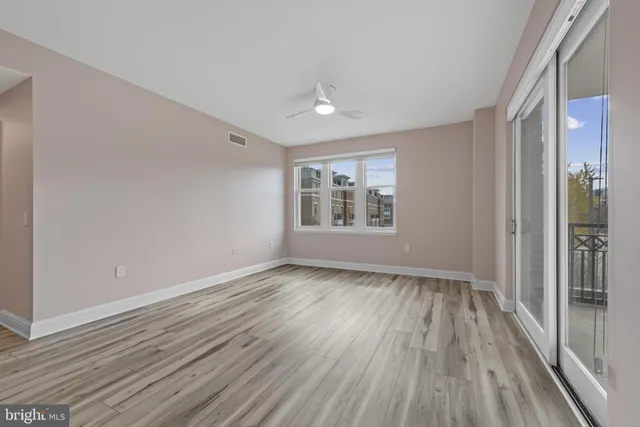 a spacious bathroom with a granite countertop double vanity and a mirror